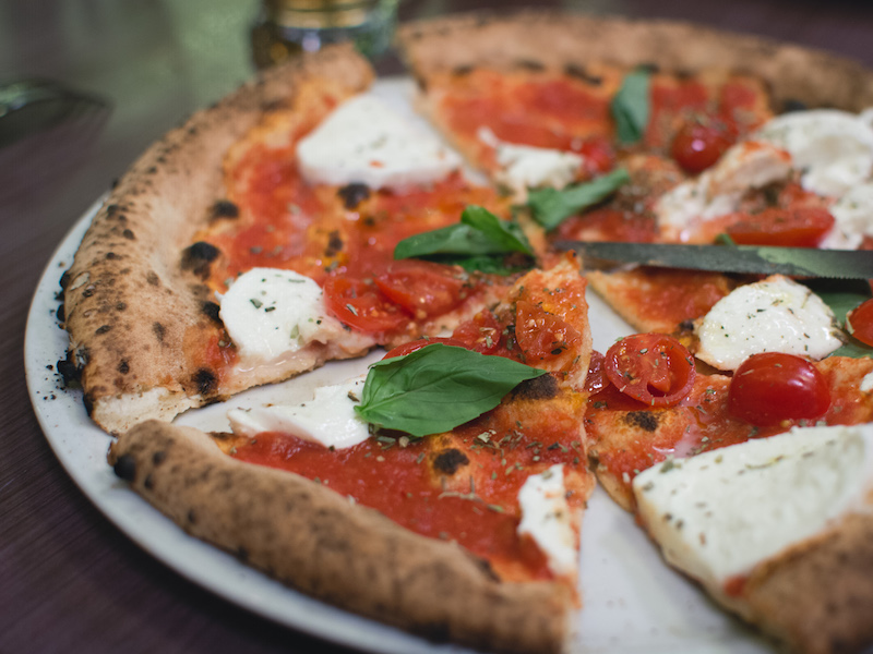 Simple italian pizza with cherry tomatoess